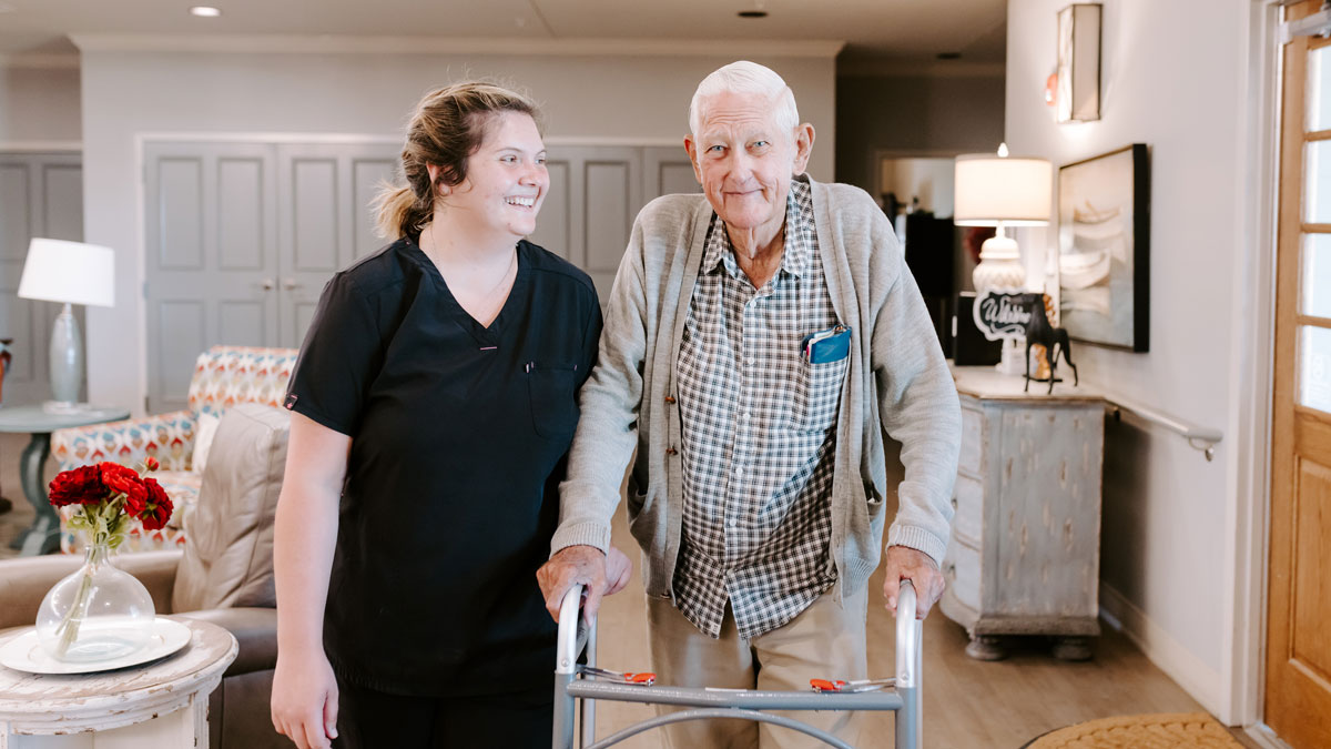 Staff Assisting Elder at Green House Cottages of Walnut Ridge